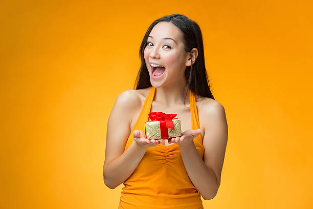 istock Chinese girl with a gift 612633670