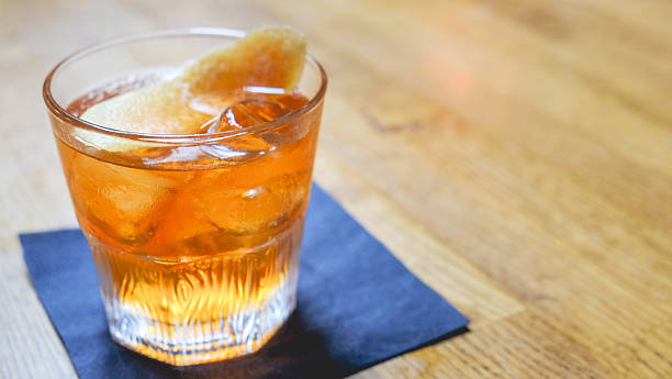 istock Glass of scotch on table 612633686