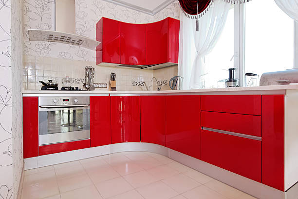 Modern glossy kitchen interior cabinet Modern glossy kitchen interior cabinet closeup red kitchen cabinets stock pictures, royalty-free photos & images