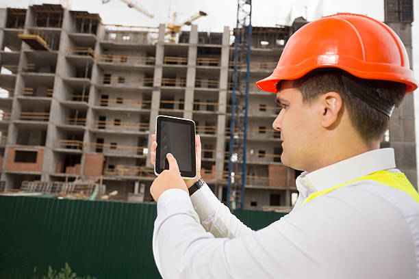 istock Portrait of construction engineer using digital tablet on building site 612635308