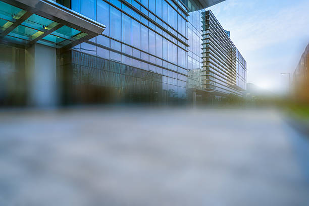 istock empty brick road nearby office building 612635562