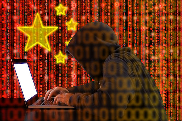 istock Chinese hacker at work in front of red flag 612635954