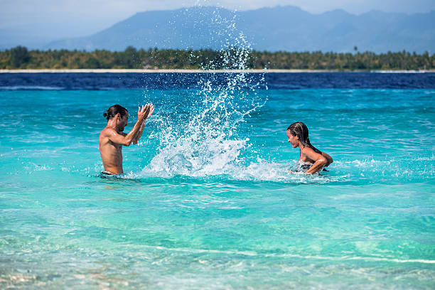 istock Young couple on the beach 612636240