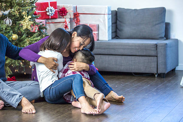 istock Mother with Her Children 612637546