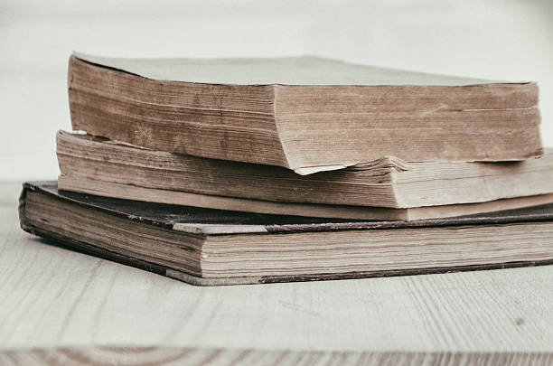istock stack of old books in the garden 612637796
