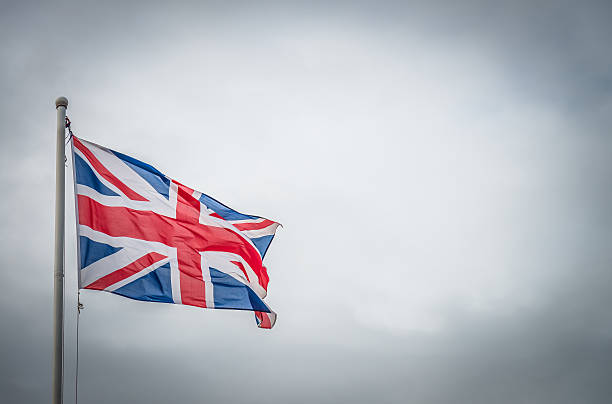 istock England flag with Cloudy sky and selective focus 612638016