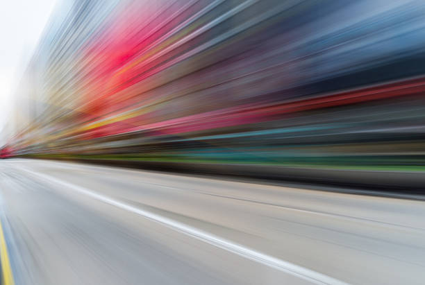 istock abstract of blurred motion urban road 612638692