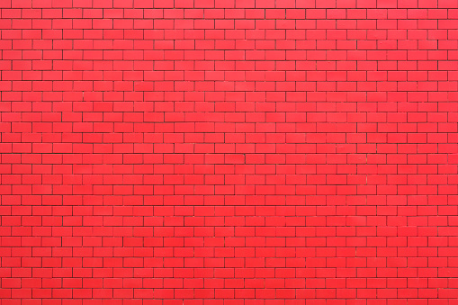 Background of red brick wall texture for design pattern artwork.