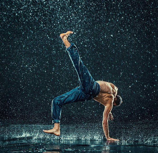 istock The male break dancer in water. 612640742