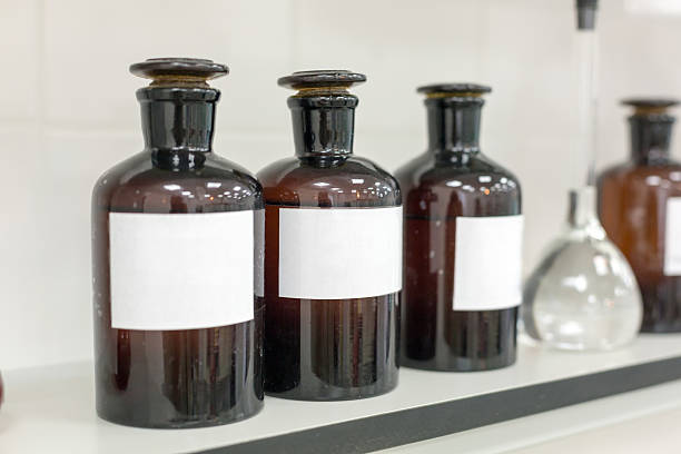 istock Brown bottles on a shelf in the laboratory. 612641400
