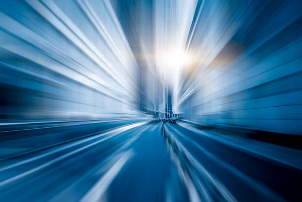 istock abstract of blurred motion urban road 612641970