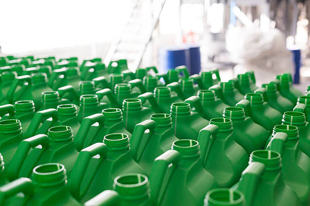 empty plastic cans green color. - plastic chemical warehouse industry imagens e fotografias de stock