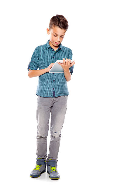 istock teenage boy with digital tablet 612645554