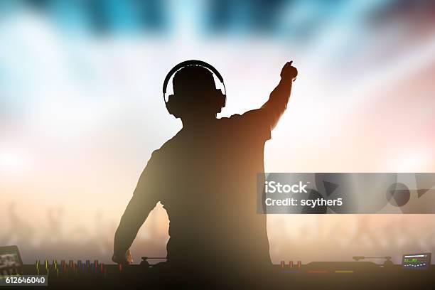 Charismatic Disc Jockey At The Turntable Stock Photo - Download Image Now - DJ, Nightclub, Turntable