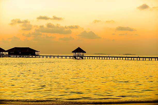 istock Island in ocean, Maldives. Sunset 612647174