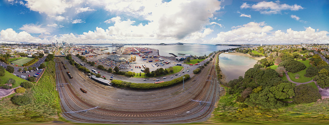 Aerial Panoramic view of Auckland City with Auckland Port and Rangitoto island in the background.