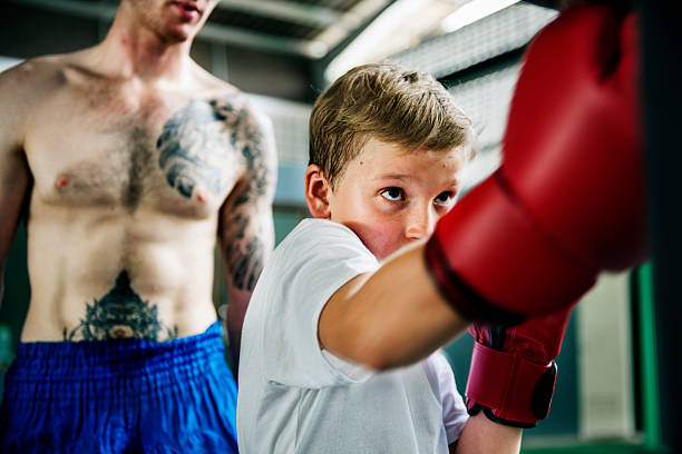 istock Boxer Boxing Coach Combat Exercise Gym Concept 612648118