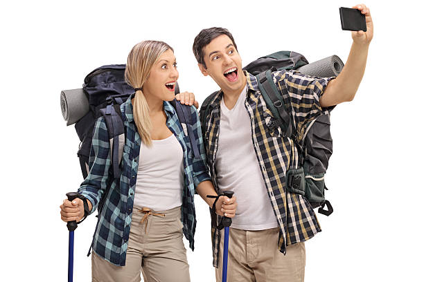 istock Cheerful young hikers taking a selfie 612648248