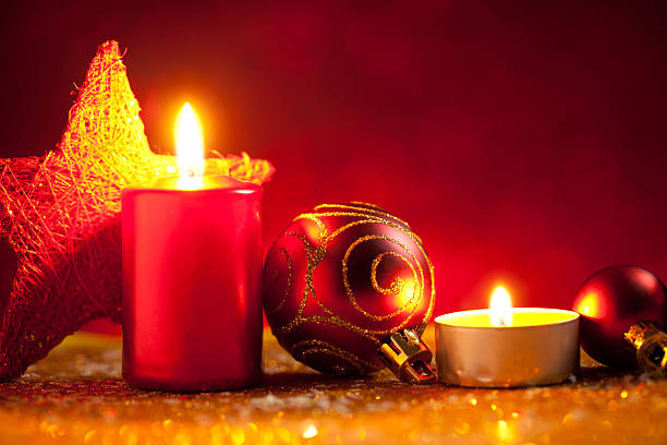 istock Candles and baubles on glitter with gold background 612649910