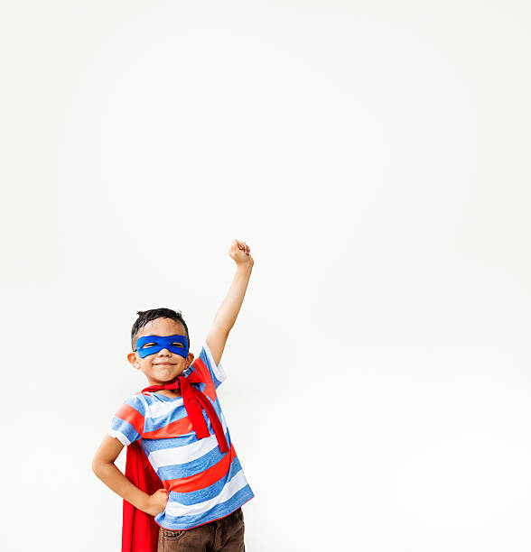 istock Superhero Kid Arms Raised Playful Concept 612649988