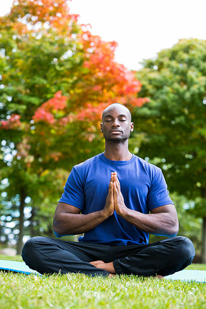 istock young man exercising yoga 612650200
