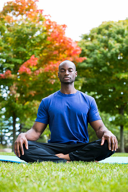 istock young man exercising yoga 612650636