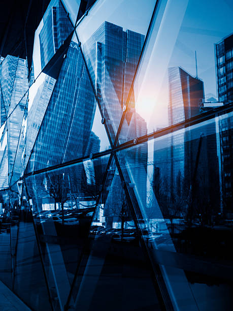 istock modern skyscrapers reflected on glass wall 612651308