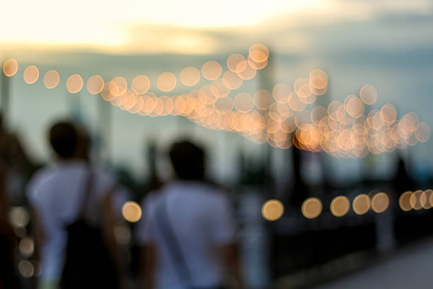 blurred people in bokeh, walking and relaxing around