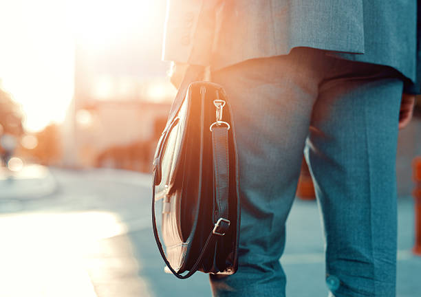 istock Business person holding a briefcase 612653710