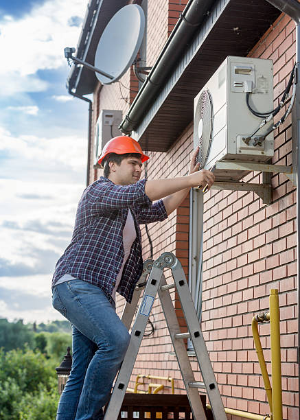 istock Young technician repairing outside air conditioning unit 612653738