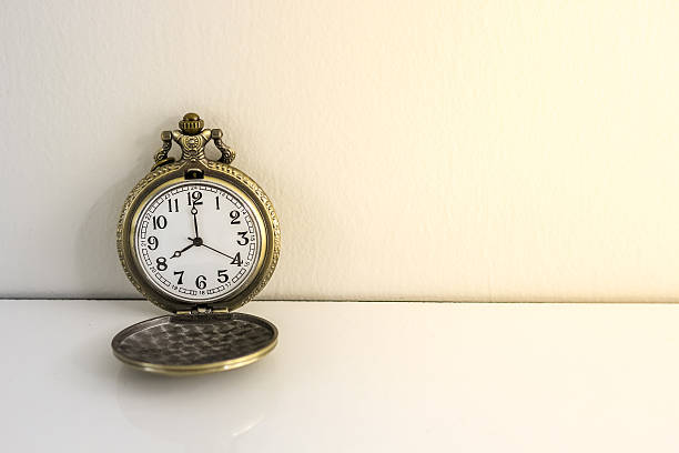 istock luxury vintage black pocket watch on wood table 612653836