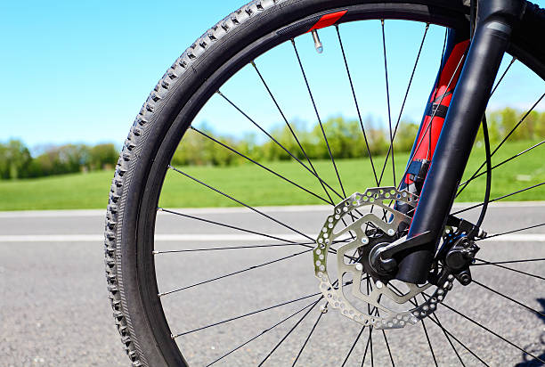istock Bicycle wheel with disc hydraulic brakes 612654974