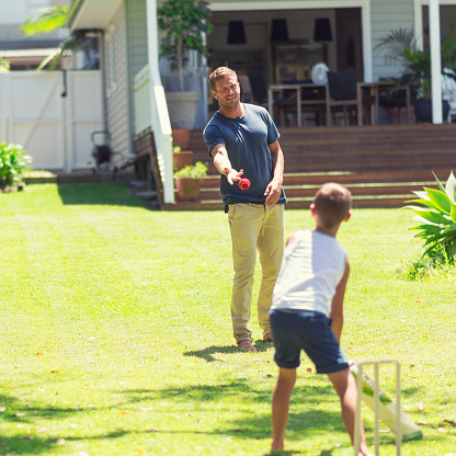 istock Australian father and son playing cricket 612655188