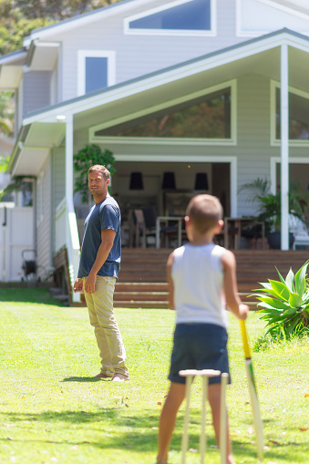 istock Father playing cricket with son 612655298