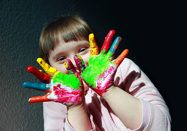 istock Cute little kid with painted hands 612655716