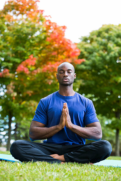 istock young man exercising yoga 612656054