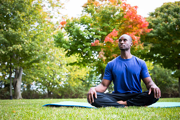 istock young man exercising yoga 612656192