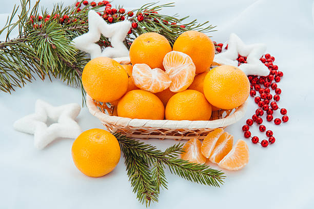 istock Christmas decoration with mandarins and fir tree 612656206