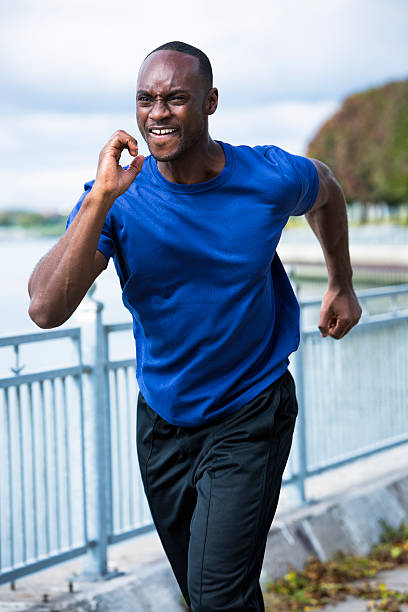 istock young man running outdoors 612656482