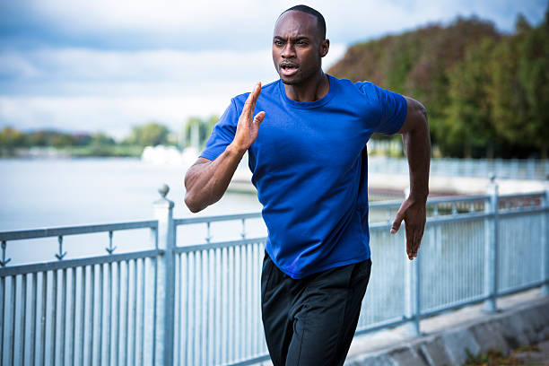 istock young man running outdoors 612656544