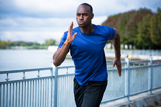istock young man running outdoors 612656602