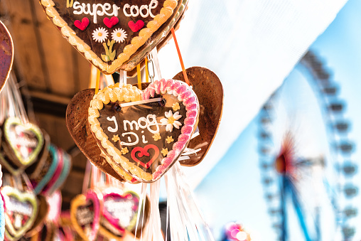 octoberfest gingerbread hearts hanging in front of ferris wheel