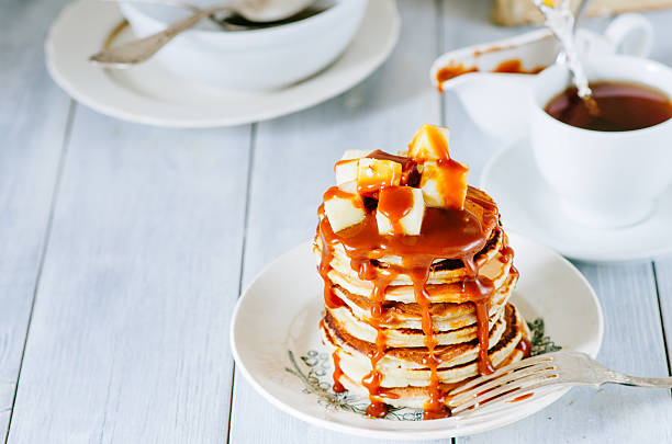 Light breakfast with pancake, apples and caramel