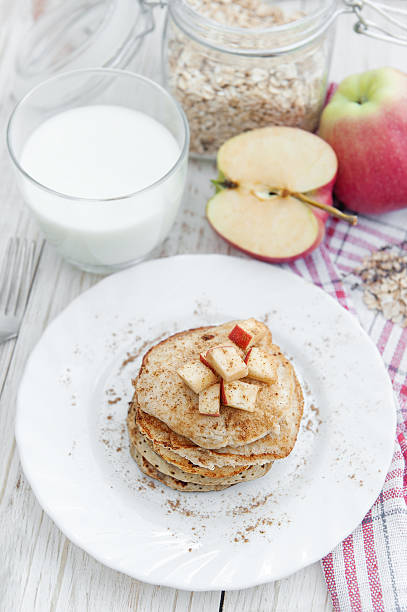 istock Oatmeal pancakes with apple and honey. 612658840