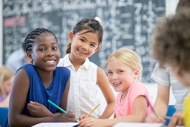 istock Girl Friends Sitting in Class 612659786