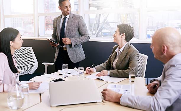 istock Businessman giving a presentation with electronic tablet in his hands 612659844