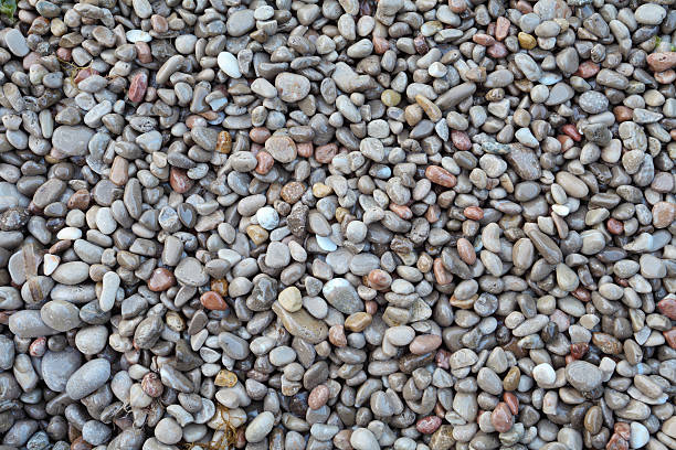 istock wet pebble stones abstract background 612660410