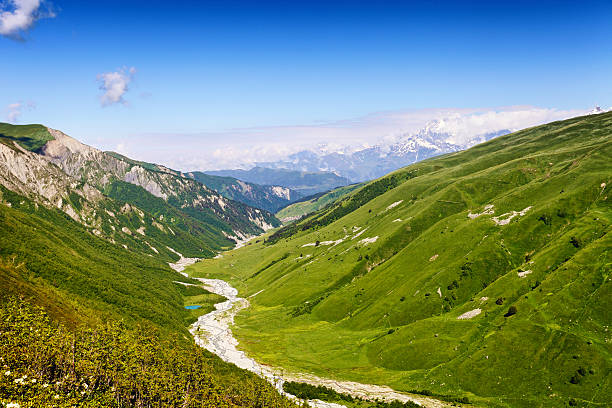 istock River between green hills, summer landscape 612660516