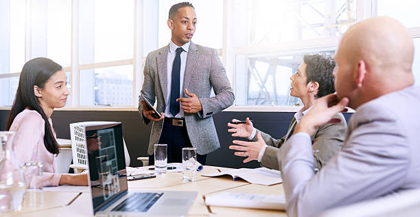 istock Businessman giving a presentation with electronic tablet in his hands 612660560