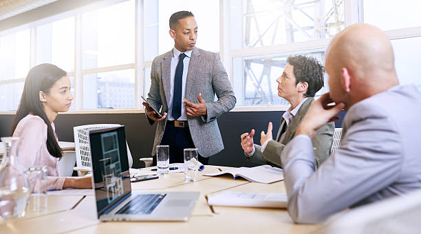 istock Businessman giving a presentation with electronic tablet in his hands 612660774